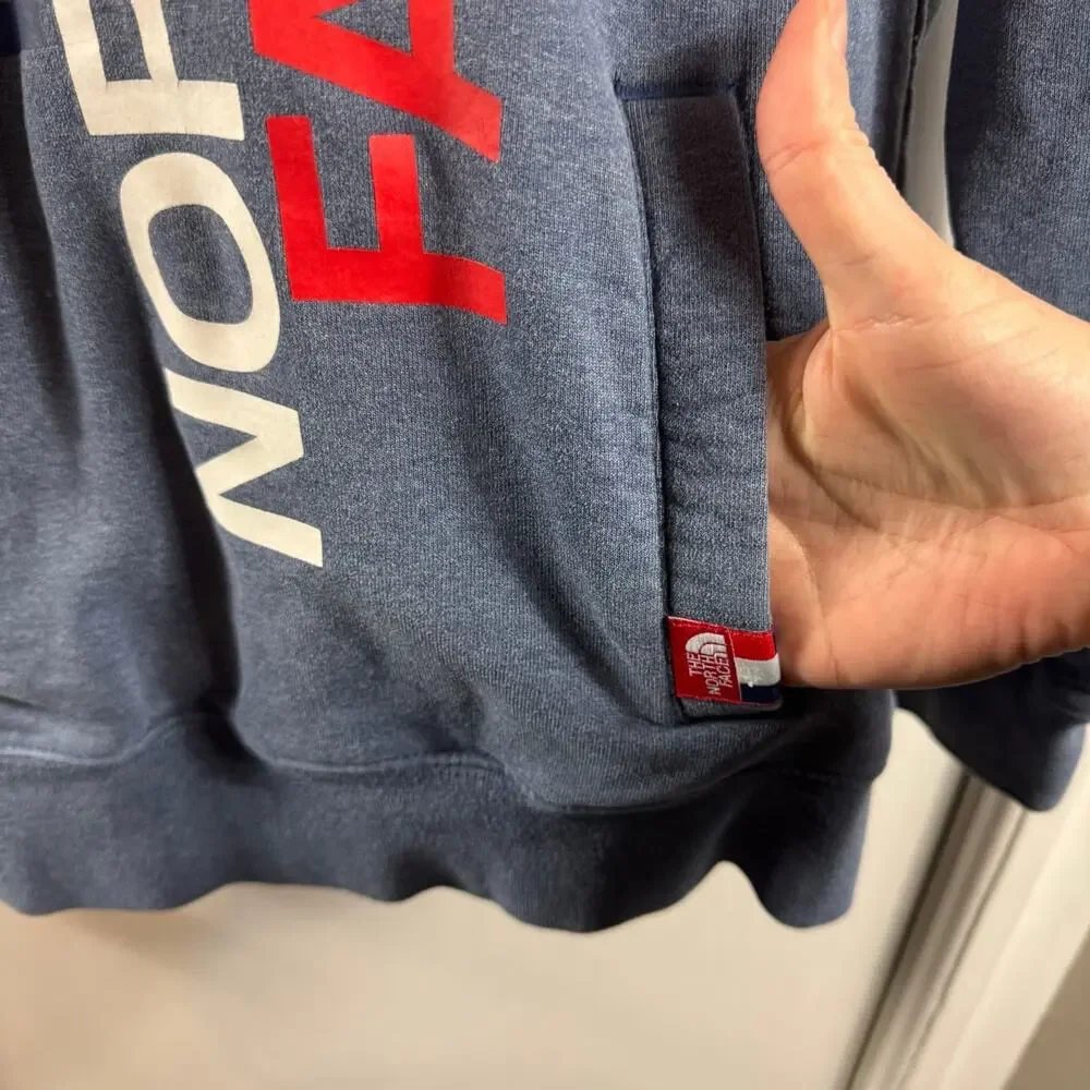 The North Face RU14 medium weight light blue graphic hooded sweatshirt
